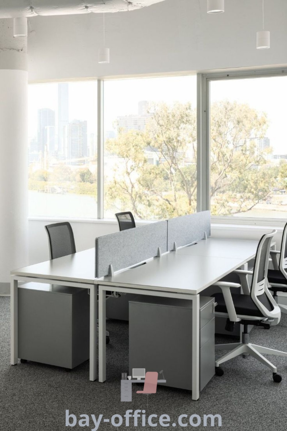 Empty conference room with two desks and chairs, large windows overlooking the city, showcasing an inspiring office interior design. Ideal for shared small office setups, workstation ideas, and office cubicle design trends. Explore more decor ideas for small spaces at bay-office.com.