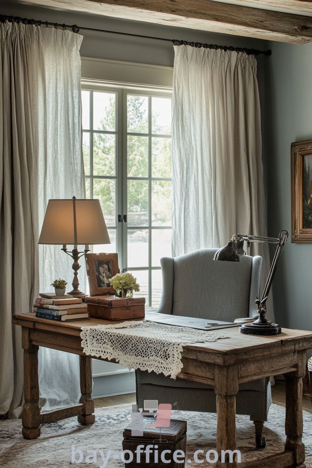 Cozy French country home office featuring weathered oak beams, pastel walls, a wooden desk with a lace runner, and vintage accents, designed to inspire productivity and warmth. Discover more ideas at bay-office.com.