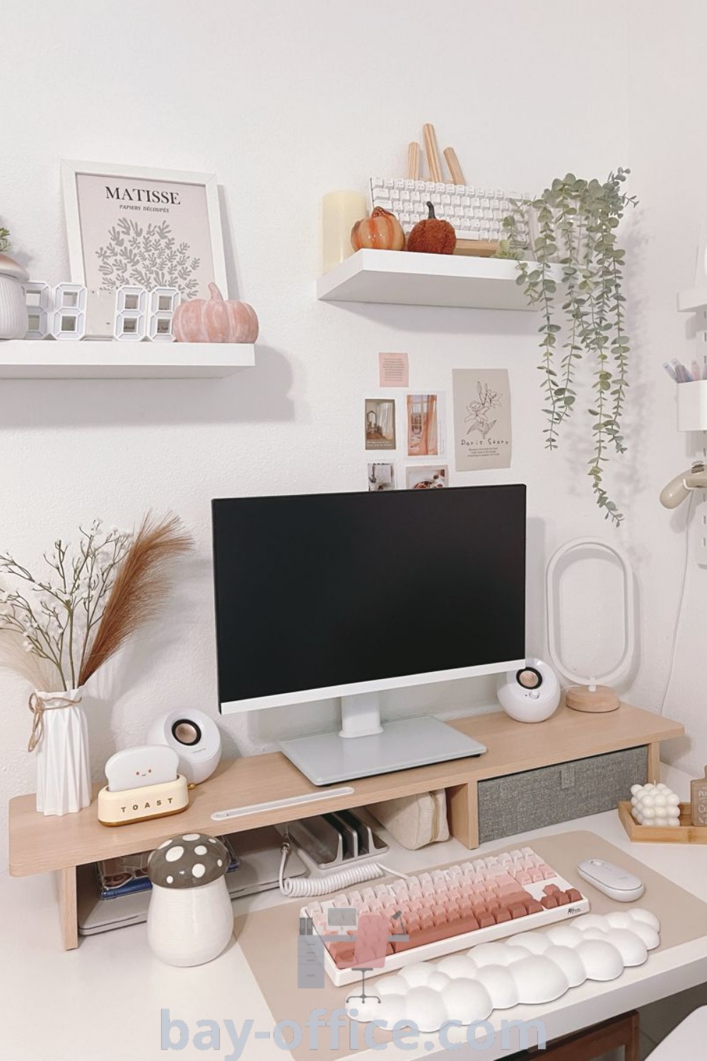 Clean desktop computer setup with stylish accessories in a small living room office. Inspiring ideas you
