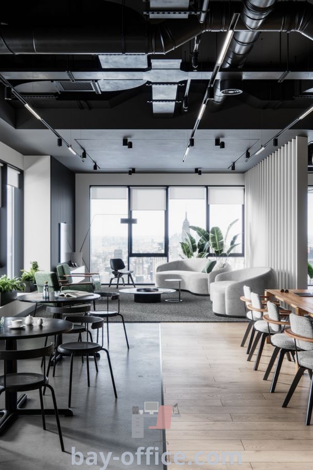 Modern industrial office space featuring minimalist decor with tables and chairs, exemplifying stylish design trends for productive workspaces. Explore inspiring office interior design ideas and cozy aesthetics at bay-office.com.