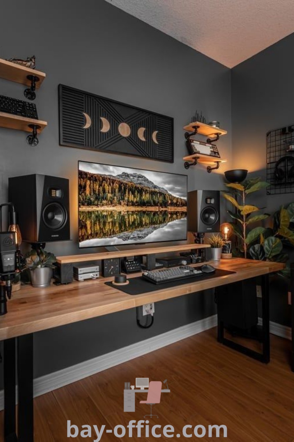 Modern home office featuring a desk with speakers and decor items, designed for productivity and cozy aesthetics. Ideal for small home offices, gaming room setups, and studio ideas. Discover more decorating ideas at bay-office.com.