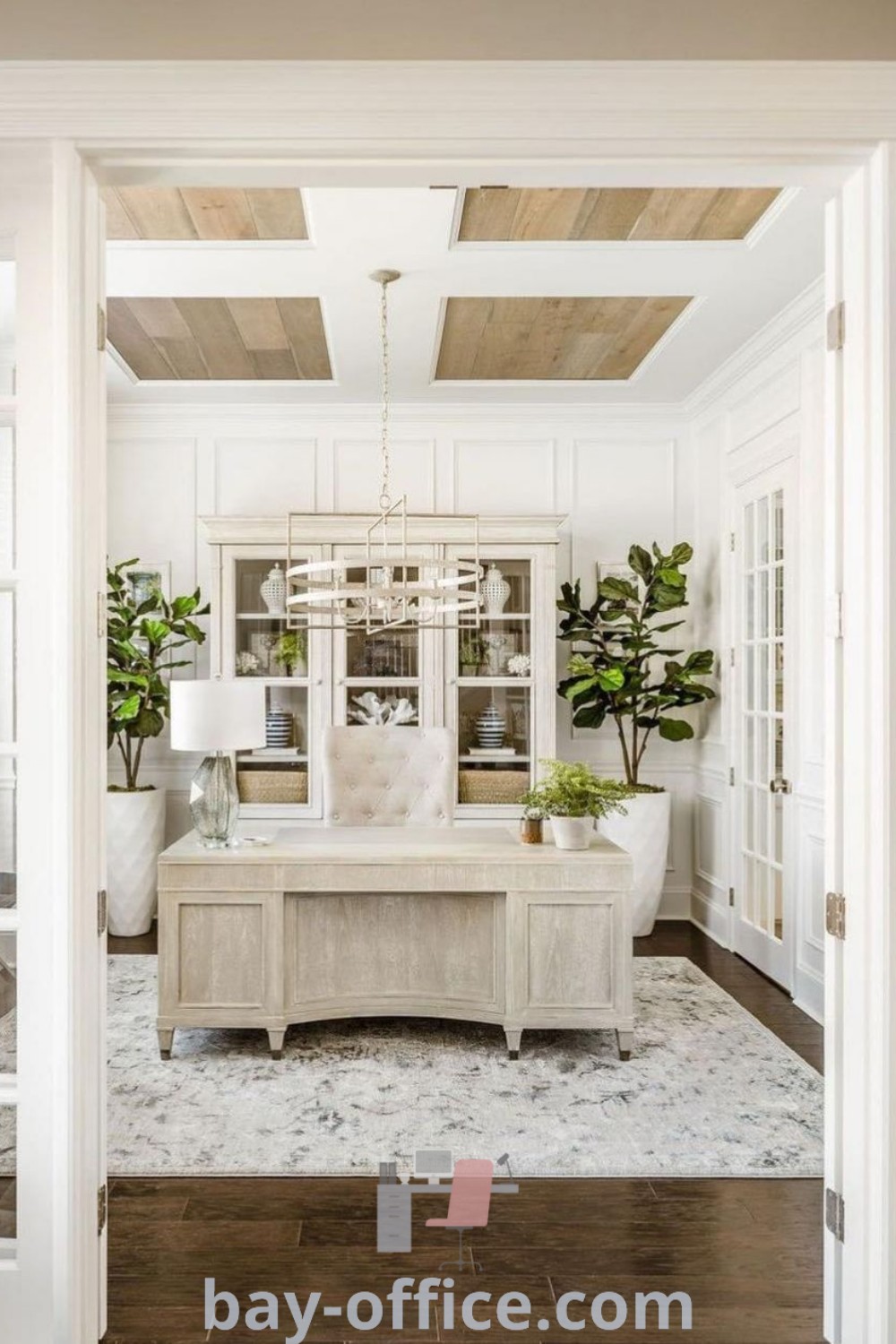 Cozy modern farmhouse office featuring lots of plants and furniture, ideal for a feminine home office setup. Explore design tips and inspiring ideas that will enhance productivity and comfort at bay-office.com.