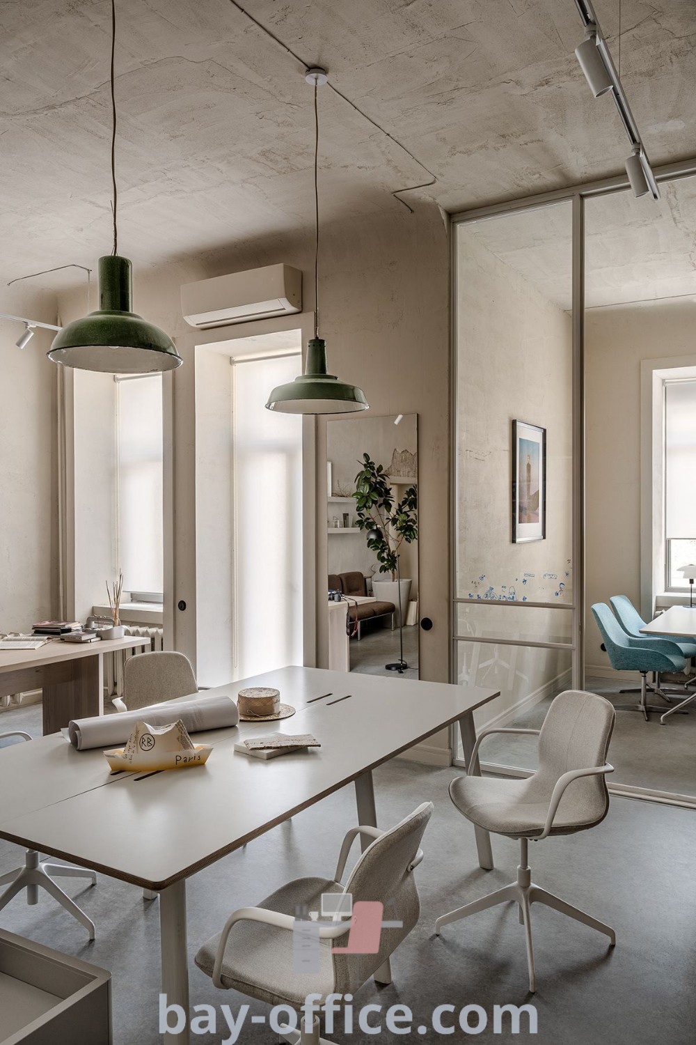 Office workspace with chairs, tables, and a green table lamp showcasing modern decor ideas. Perfect for creating a cozy aesthetic and inspiring productivity in both home and design studios. Discover more at bay-office.com.