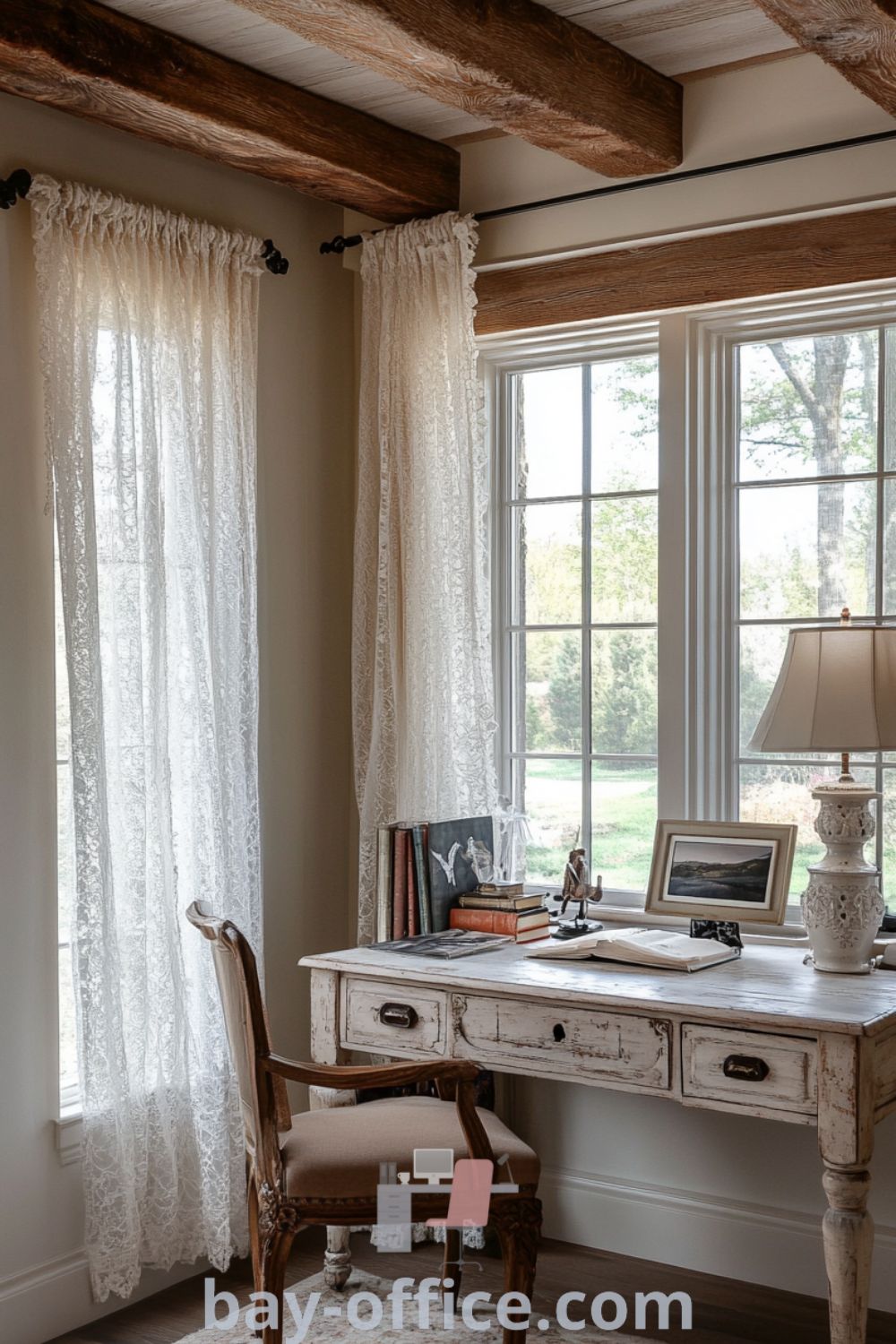 Elegant French country home office featuring soft-painted walls, rustic wooden beams, a weathered oak desk, vintage books, and decorative ceramics, designed to inspire productivity and creativity. Discover more design tips at bay-office.com.