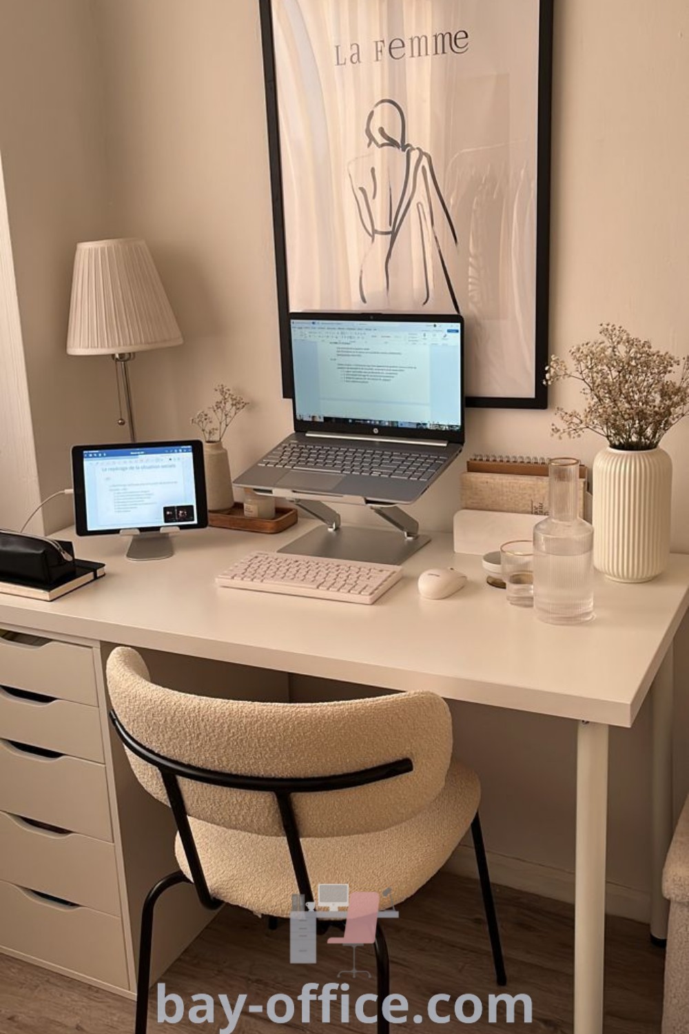 A laptop computer on a white desk next to a lamp and chair, showcasing trendy desk ideas in a bedroom setting. Discover inspiring decor ideas for small spaces and functionality at bay-office.com.