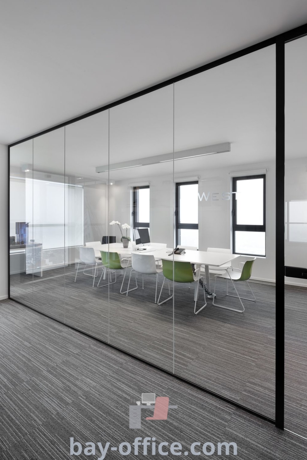 Empty conference room with glass walls and chairs, showcasing natural office design and contemporary decor ideas that enhance productivity. Discover inspiring office design concepts at bay-office.com.